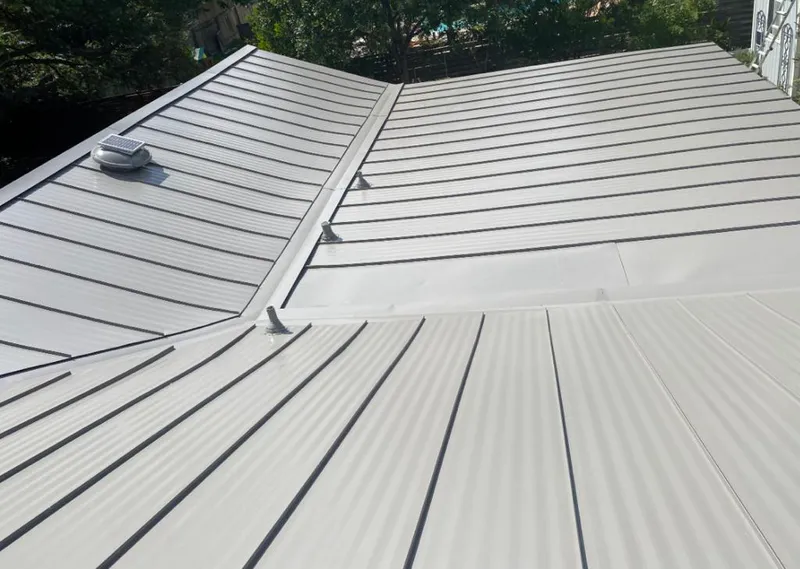 Solar attic fan installed on a metal roof for Roof Ventilation in Weatherford